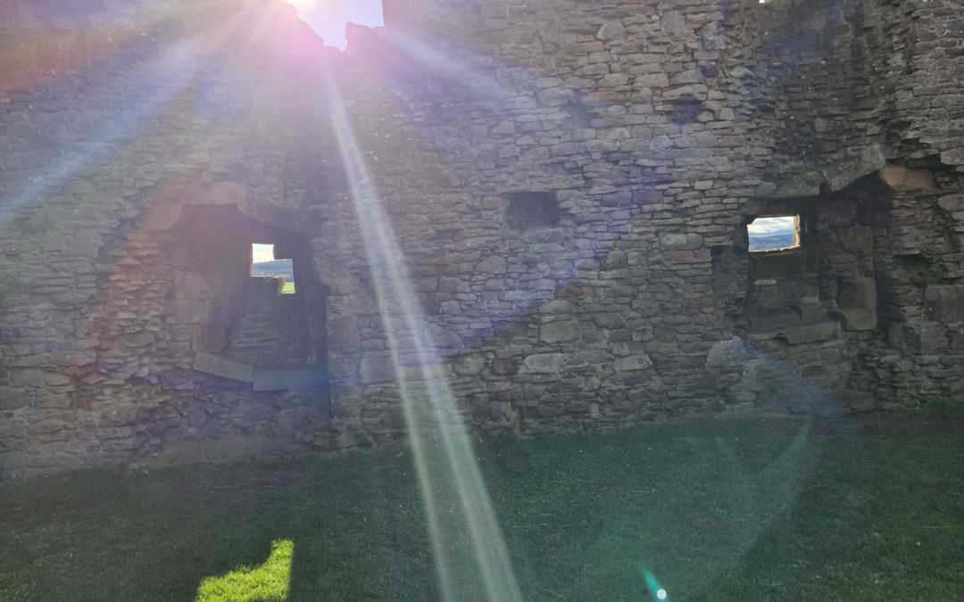 Soie-2014-nudge Sunlight streaming through openings in an old stone wall, representing bringing hidden aspects into awareness